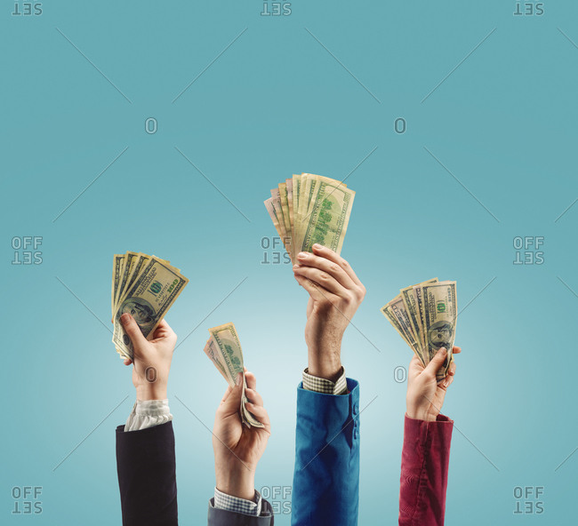 Hands holding up money