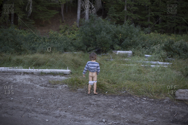 A Young Boy Takes A Moment To Relieve Himself Stock Photo OFFSET