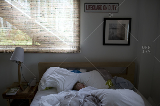 Comfortable couple sleeping in underwear and t-shirts stock photo - OFFSET