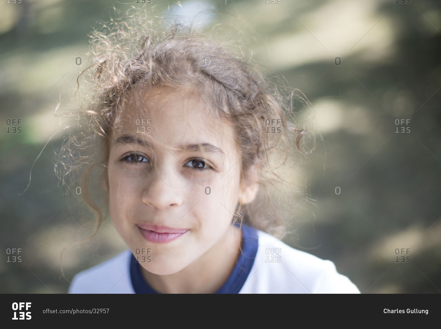 Portrait of young Caucasian girl smiling outdoors