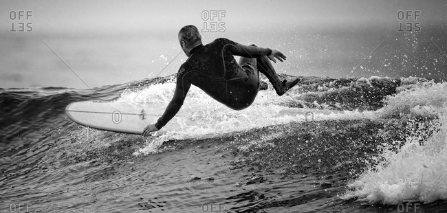 Middle aged  man surfing