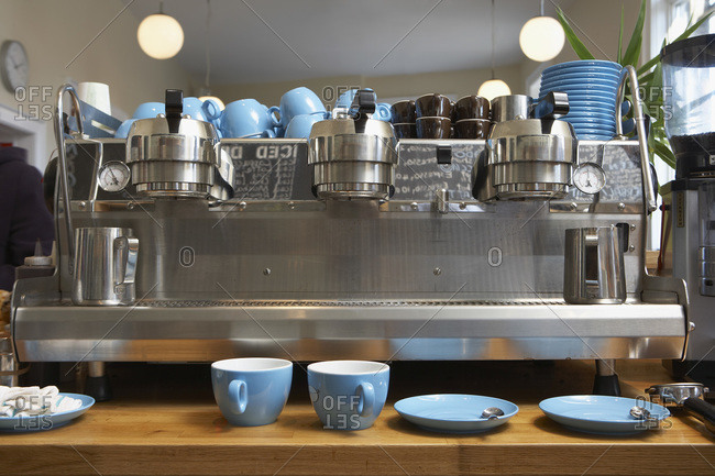 Modern coffee machine on table in kitchen Stock Photo by ©serezniy