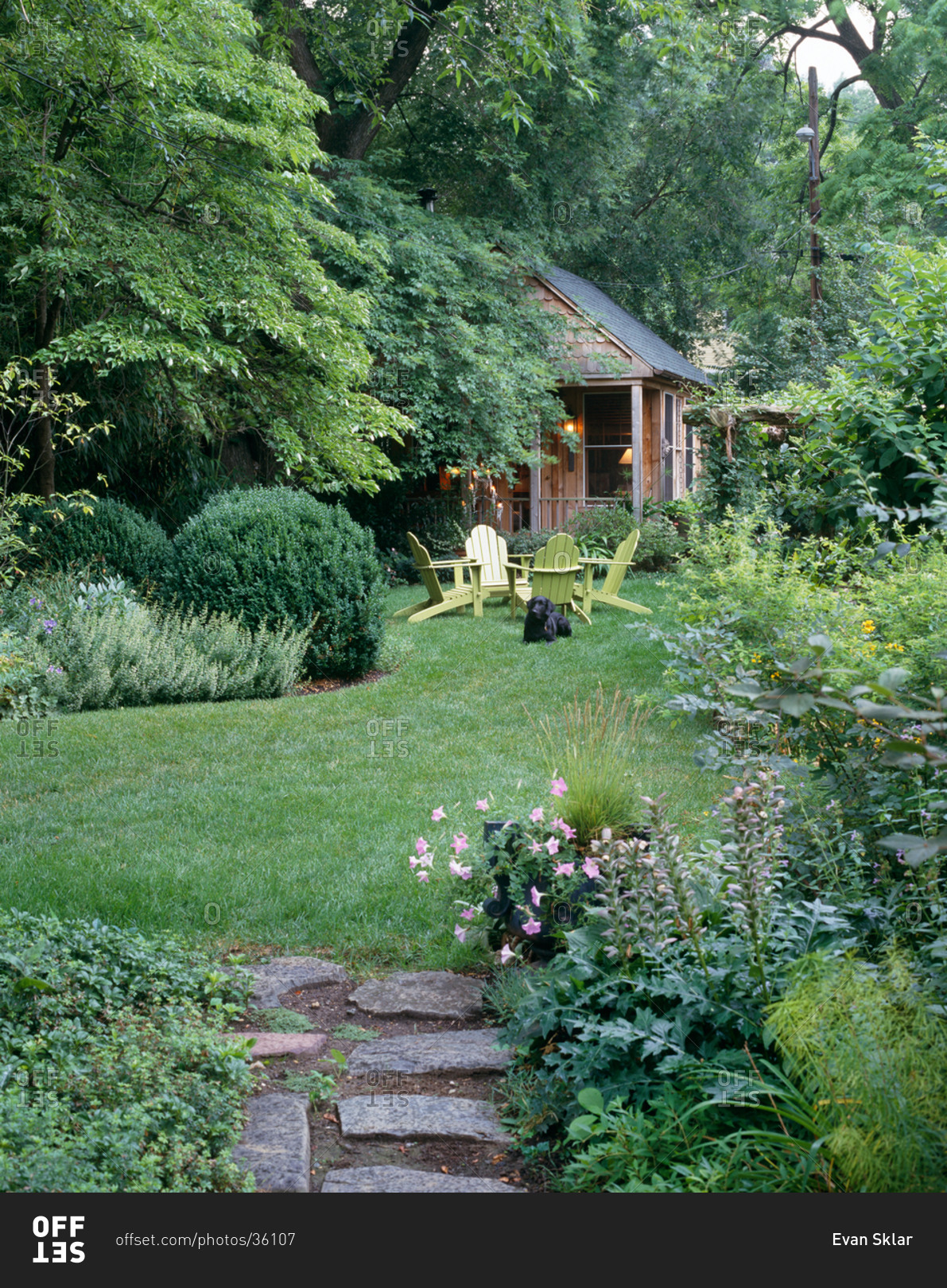 A garden and small cabin in summer stock photo - OFFSET