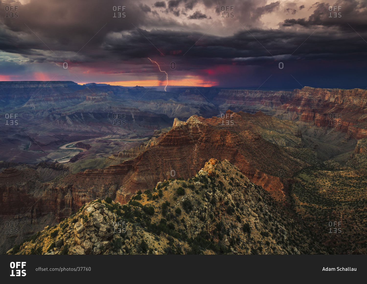 Lightning erupts from a summer thunderstorm over the Grand Canyon and the Colorado River