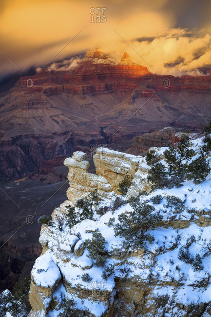 A winter storm sweeps across the Grand Canyon In the distance are Buddha Temple and Isis Temple, and Plateau Point above the Colorado River