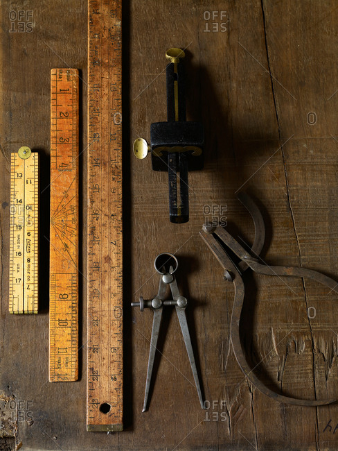 Still-life of engineer's scale and outside calipers.