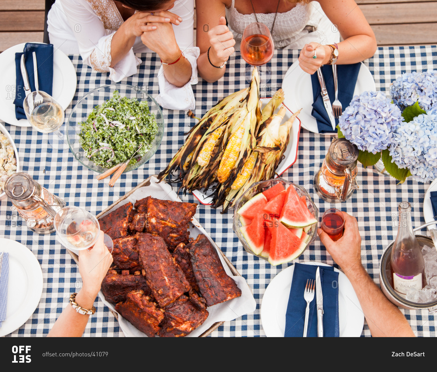 Overhead shot showing young Caucasian friends having barbeque party outdoors