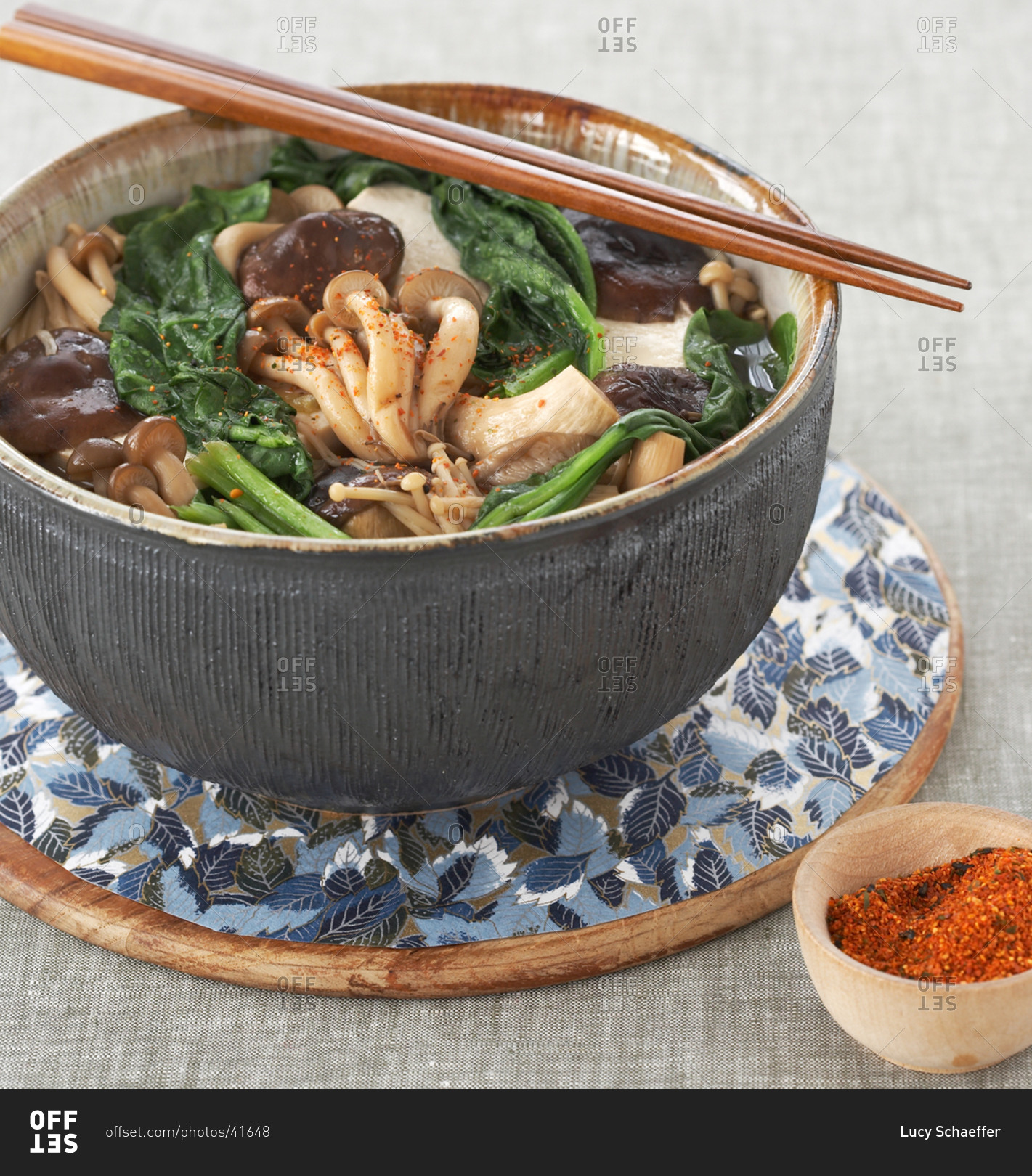 Japanese mushroom soup with spoon and chopsticks on table