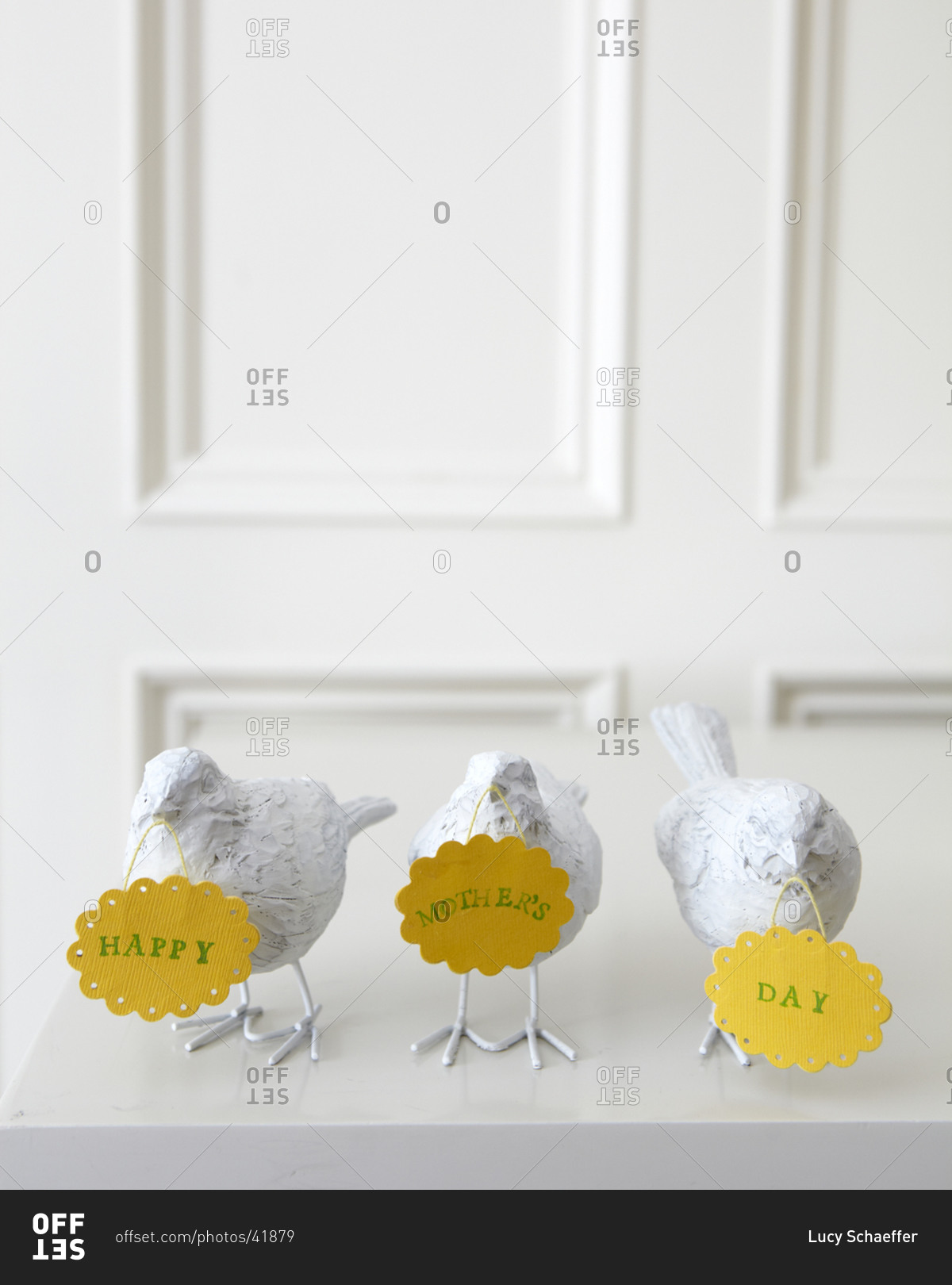 White ceramic birds with place cards