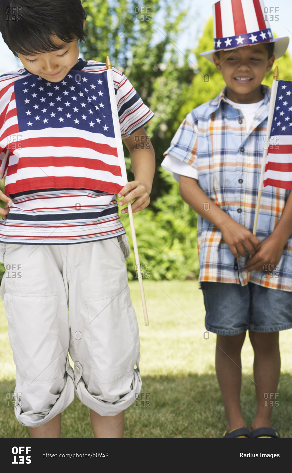 Boys holding American flags