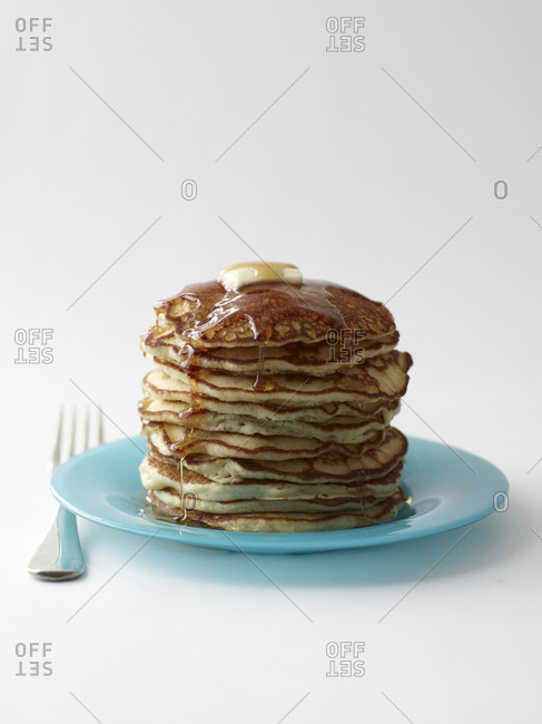 Pancakes with syrup and butter on plate