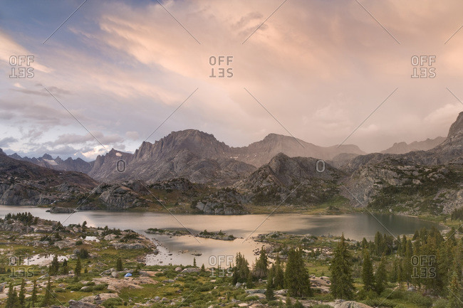 USA,  Wyoming,  Bridger National Forest,  Bridger Wilderness Sunset on Wind River Range and Island Lake with tent in foreground