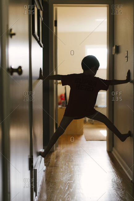 Boy Playing in Hallway - Offset