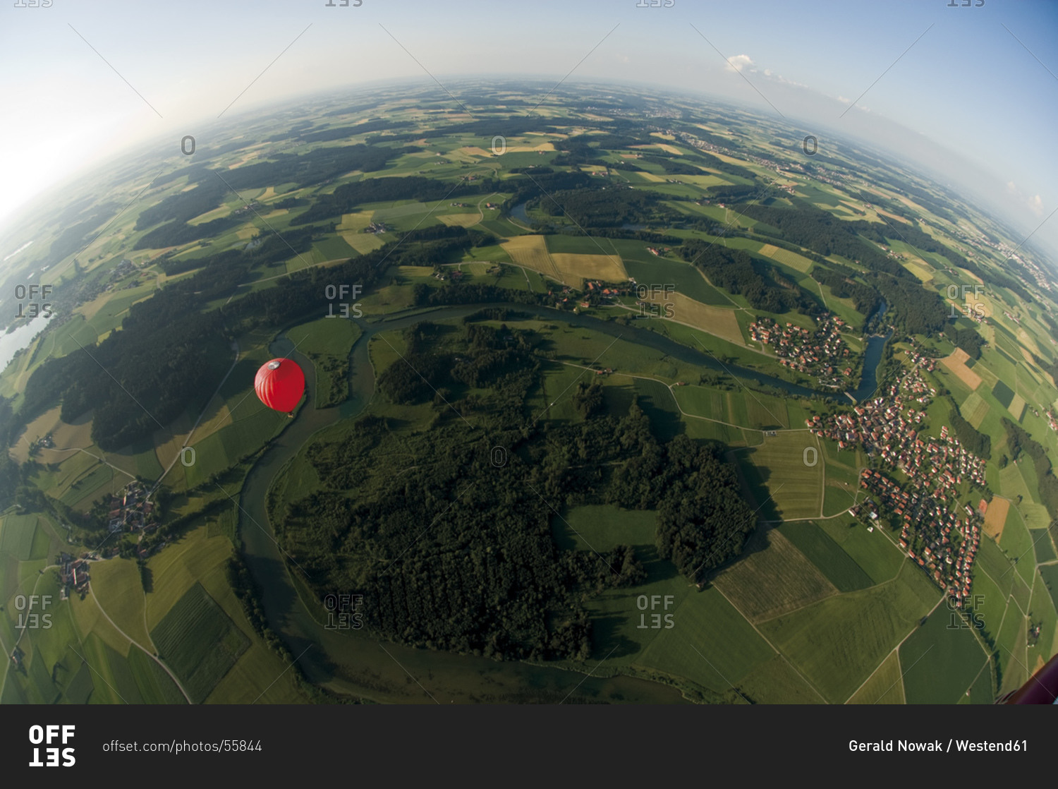 Germany, Bavaria, View of hot air balloon over pasture landscape