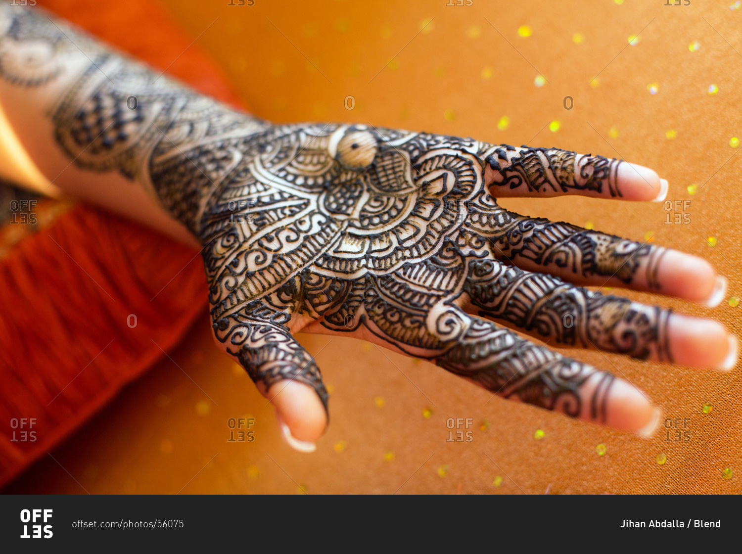 Close up of hand with intricate henna design
