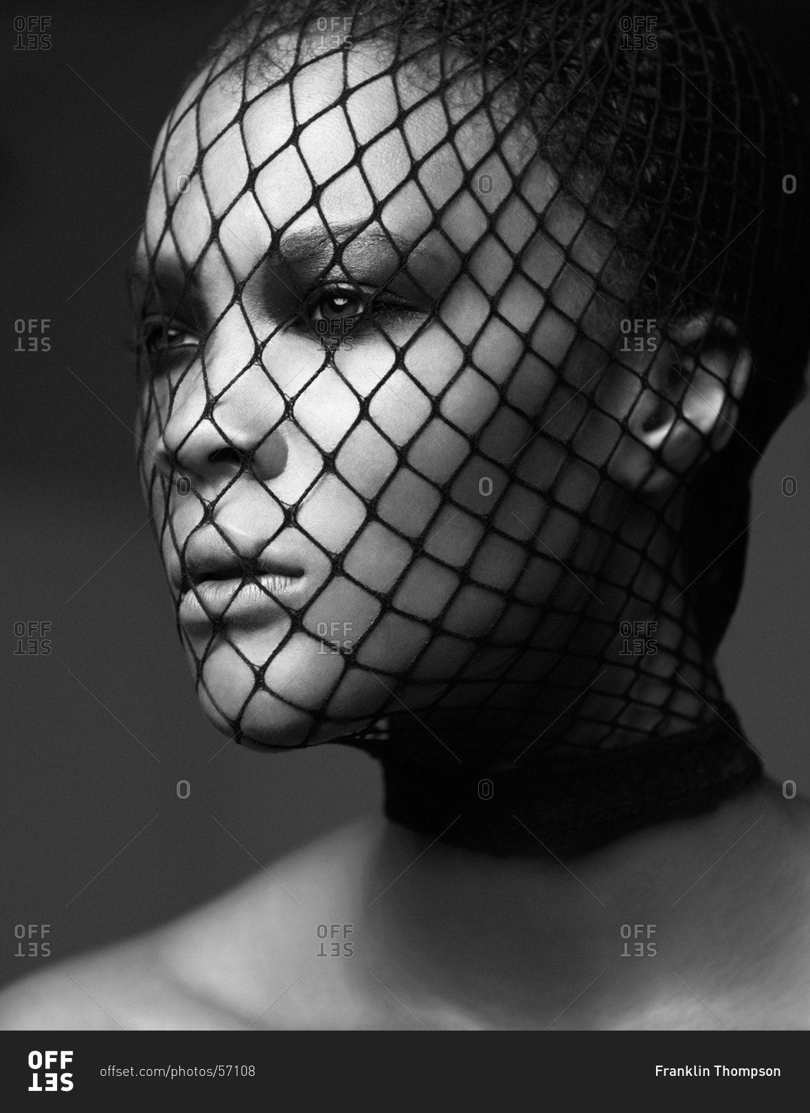 Head shot of dark-haired model with face net
