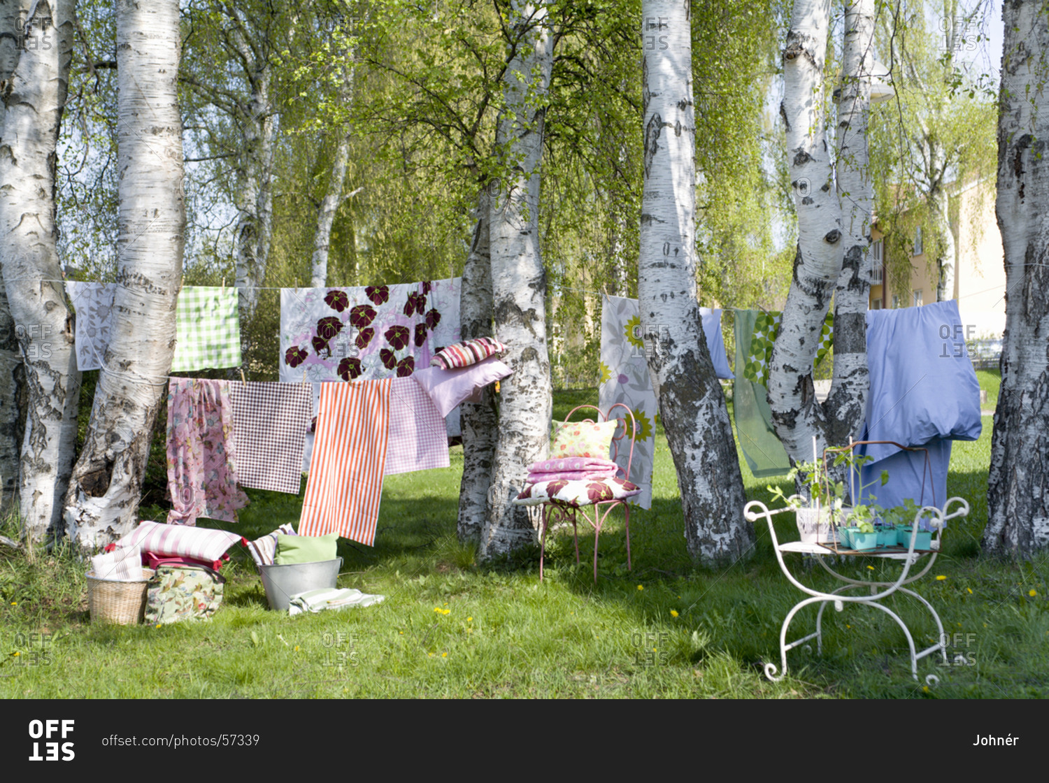 Bedclothes hanging on clothes line stock photo - OFFSET