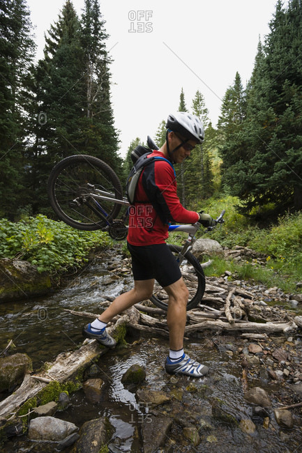 Mountain biker in wilderness - Offset