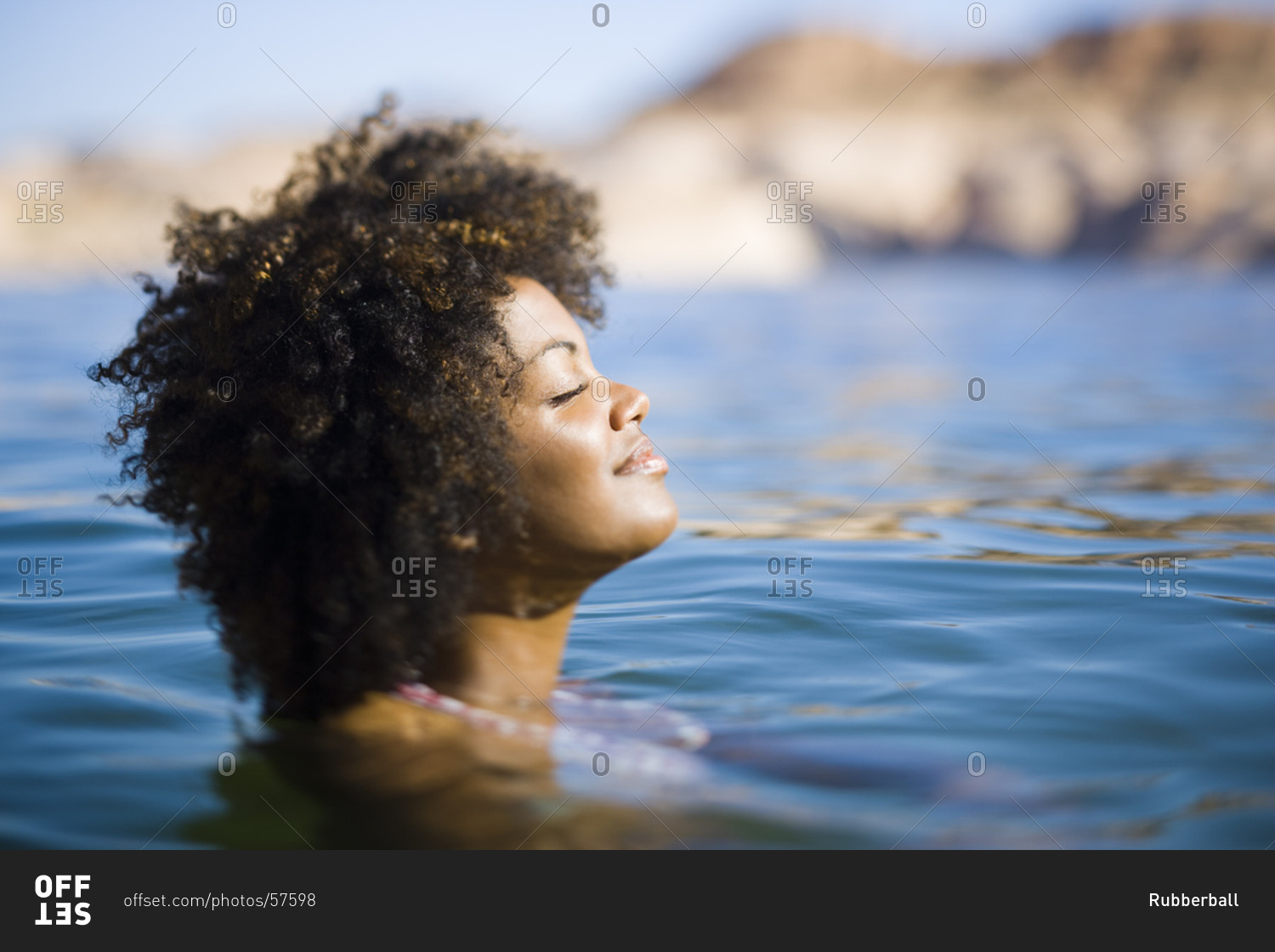 Woman in water with only her head above