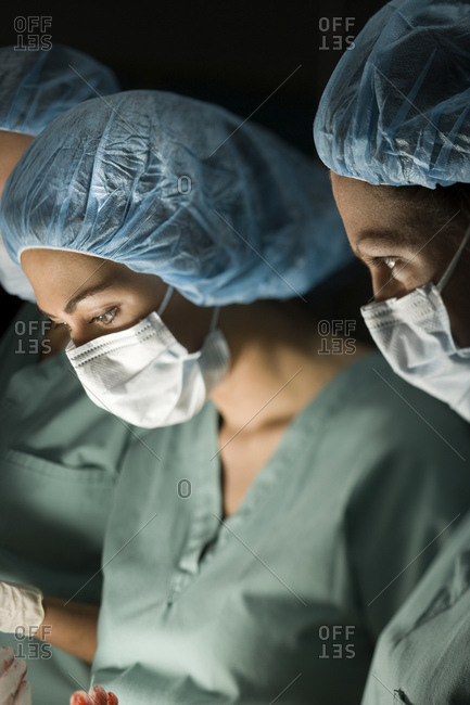 Medical personnel in surgery - Offset