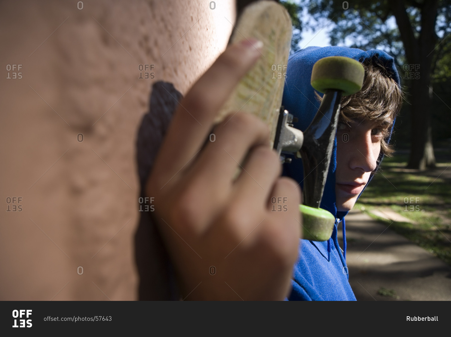 Close up of teenager with skateboard