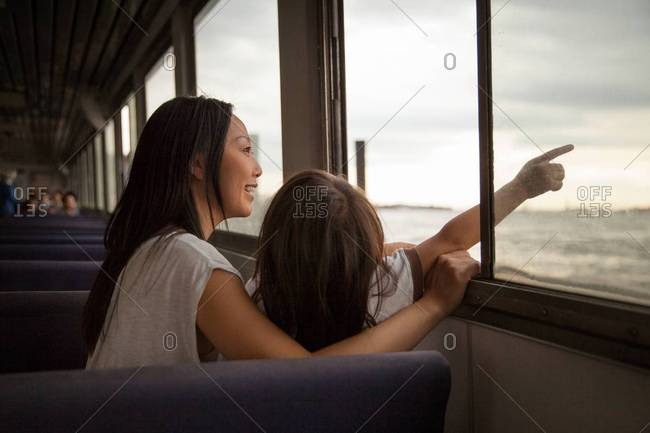 Mother and daughter traveling on a ferry