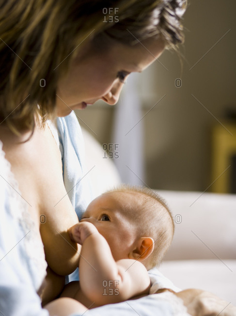 Mother breast feeding infant - Offset