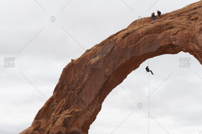Rappelling off of the Carona Arch in Moab, UT