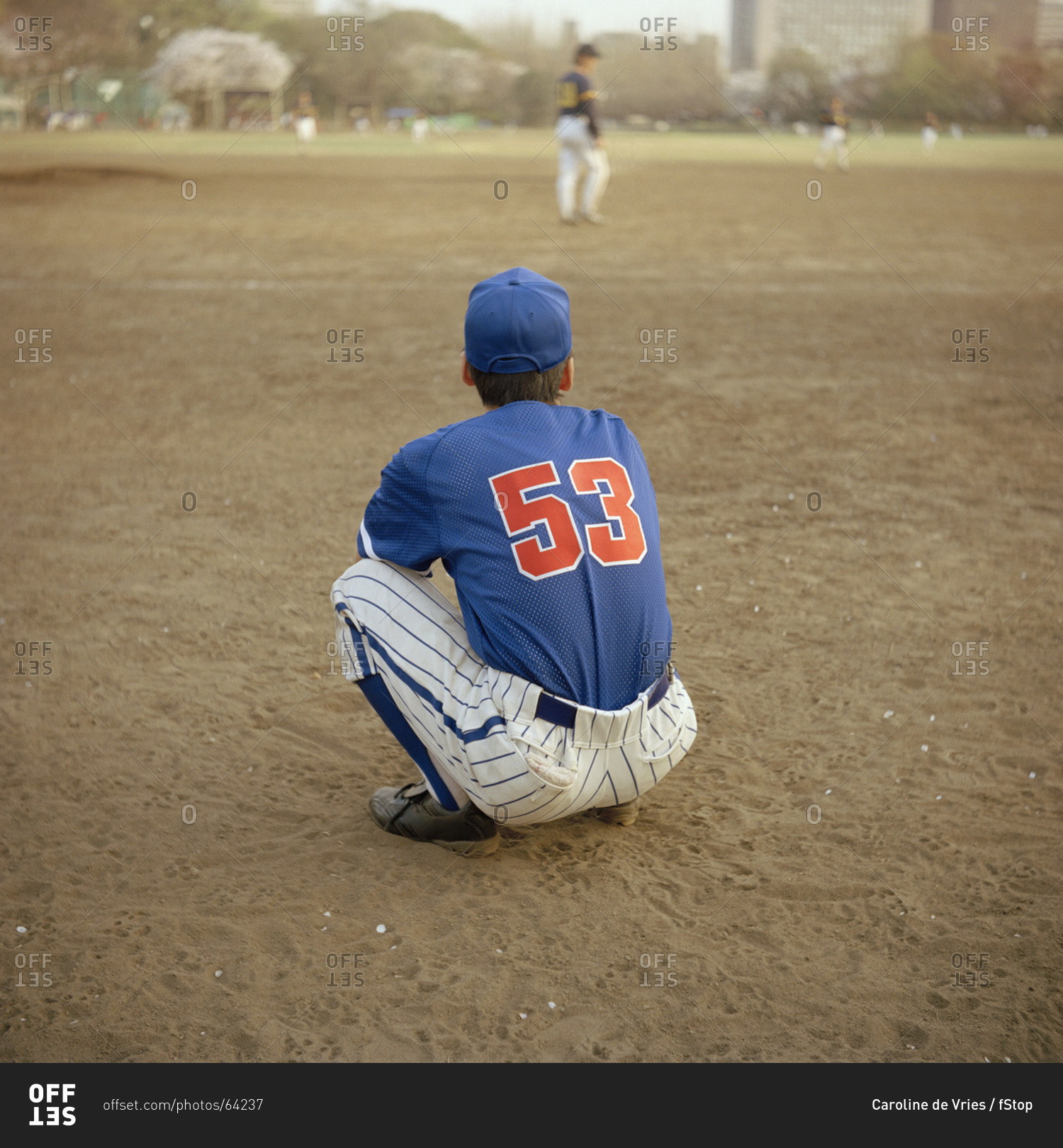 Baseball player crouching on the field