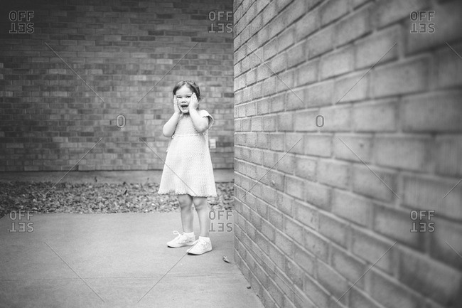 Young girl looking amazed outdoors