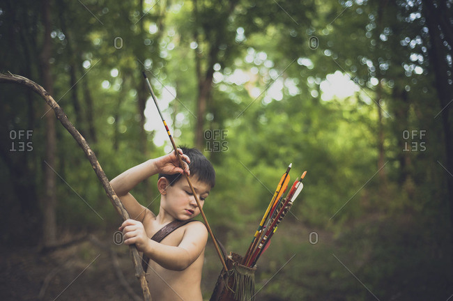 Little boy practicing archery - Offset