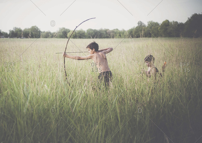 Two boys practicing archery - Offset
