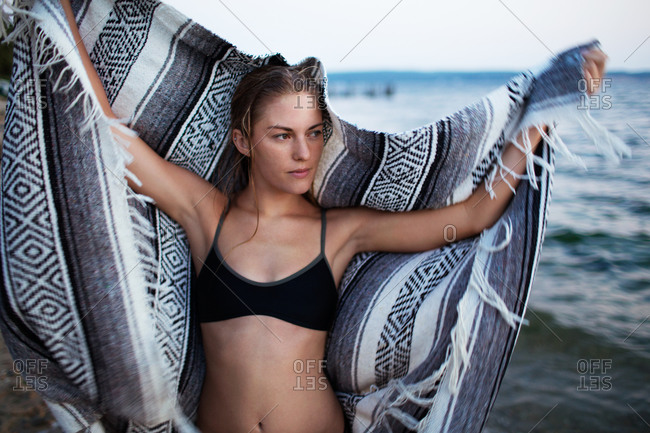 Close up of a woman holding a striped blanket