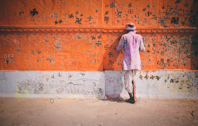 Indian man praying during Holy Festival in Mathura, India