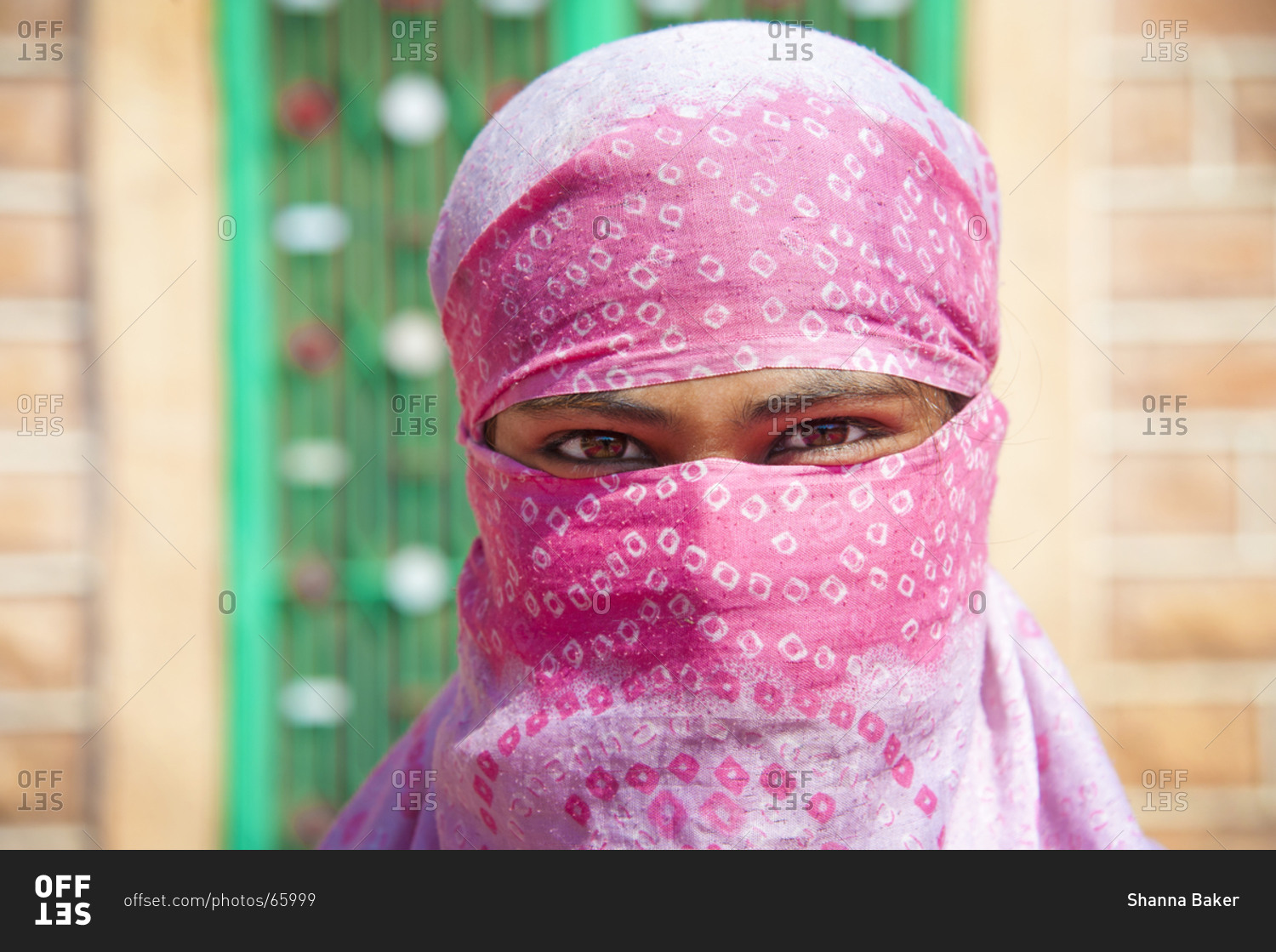 Woman worker smiling behind her head scarf in Jodhpur, India
