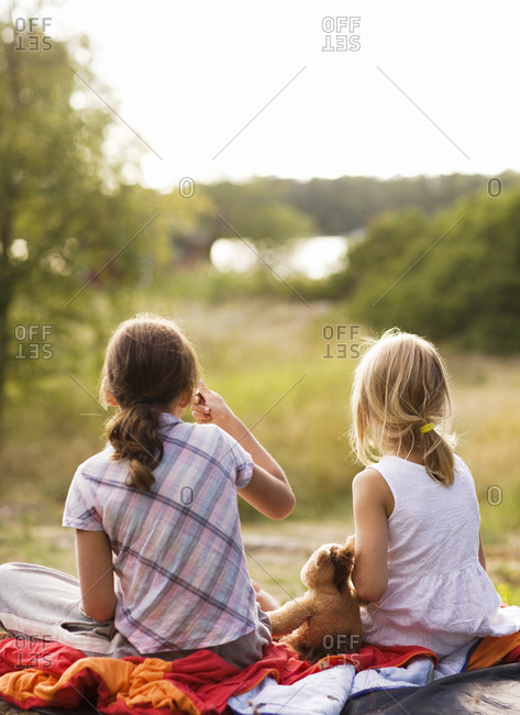 Two girls sitting on a blanket Sweden