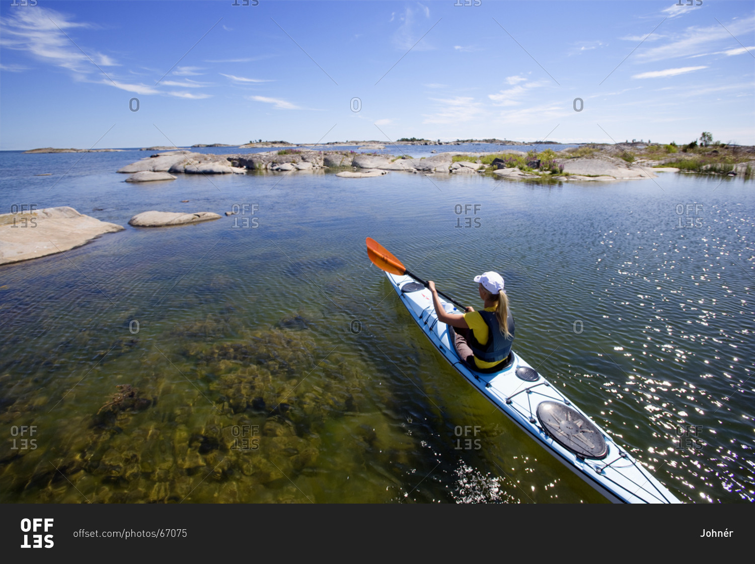 Woman kayaking in sea