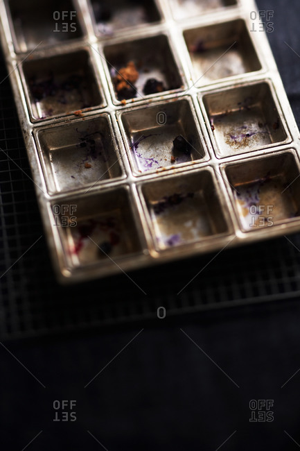Close-up of empty, dirty muffin pan