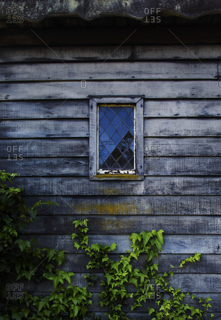 Close-up of window of wooden cottage