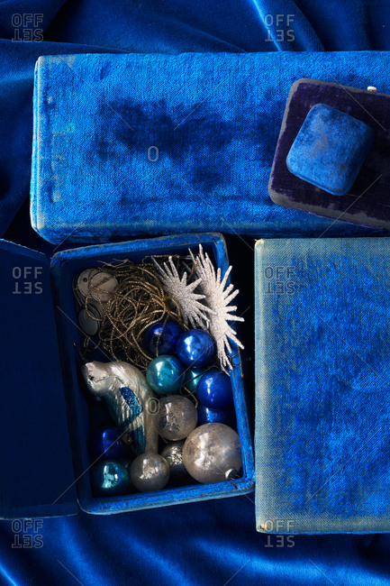Close-up of blue ornaments and velvet gift boxes