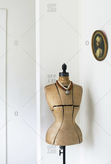 Vintage dress form standing in the corner