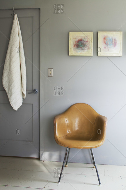 Leather chair by a closed door