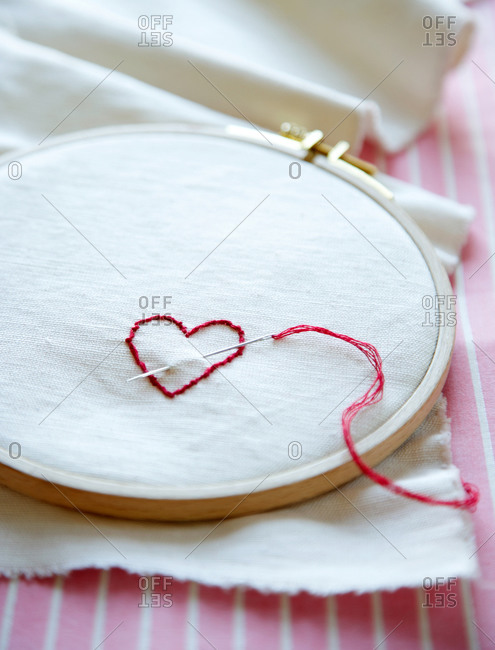 Heart embroidered with red thread