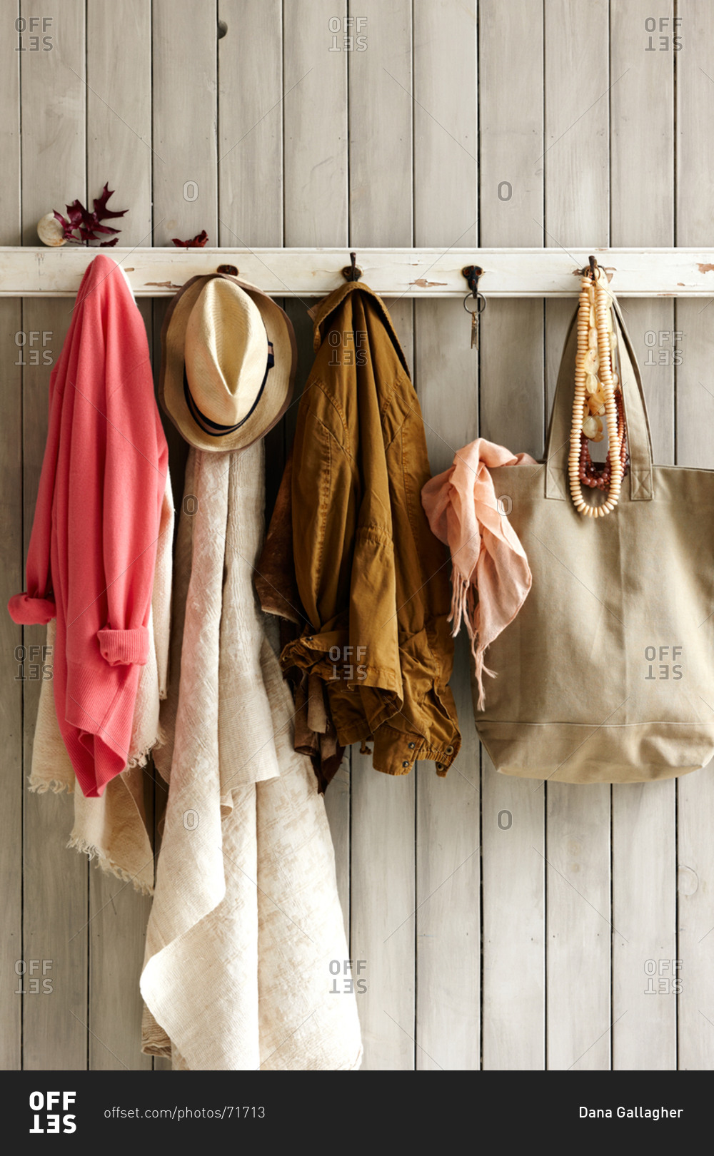 Clothes hanging on a coat rack stock photo - OFFSET