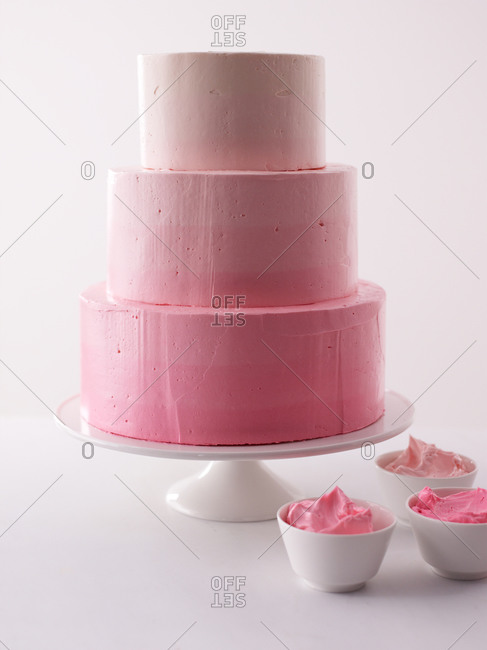 Pink ombre cake on cakes stand