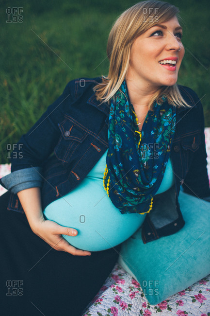 Portrait of a beautiful pregnant woman wearing a saree stock photo - OFFSET