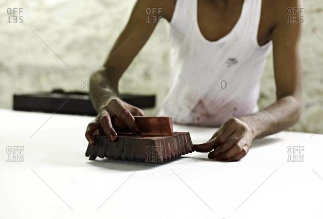 Indian man hand block prints on textile