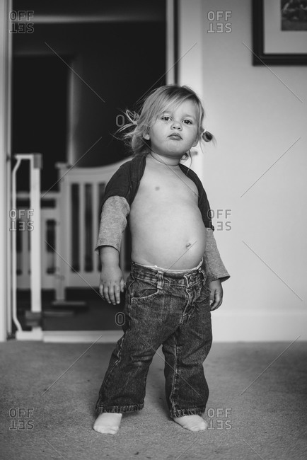Little girl posing bare-chested