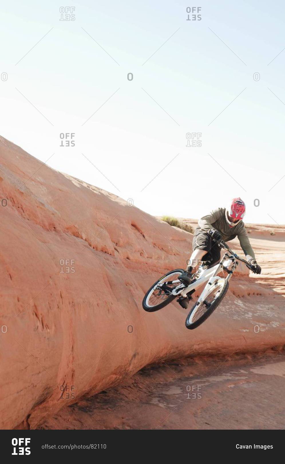 Man doing a stunt on a BMX bicycle