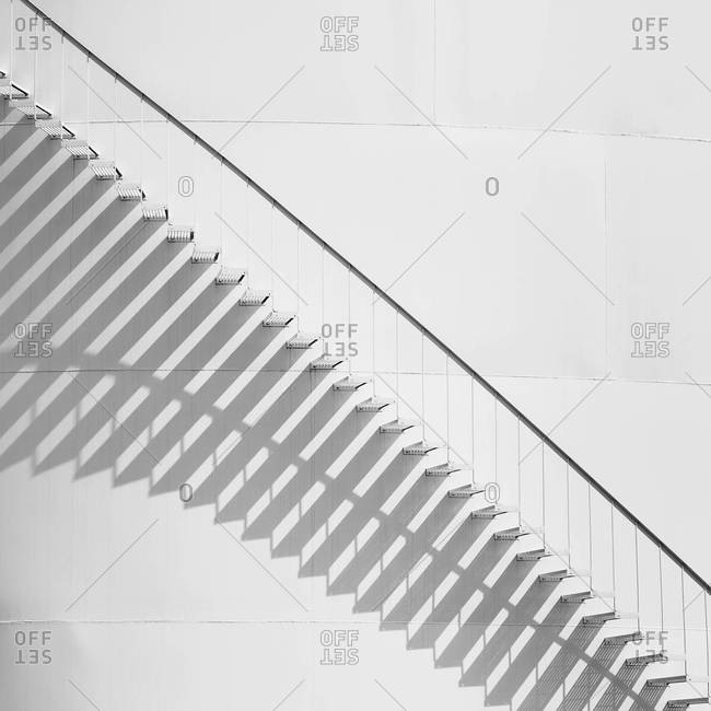 Steps leading up the side of a white storage tank at an oil refinery plant
